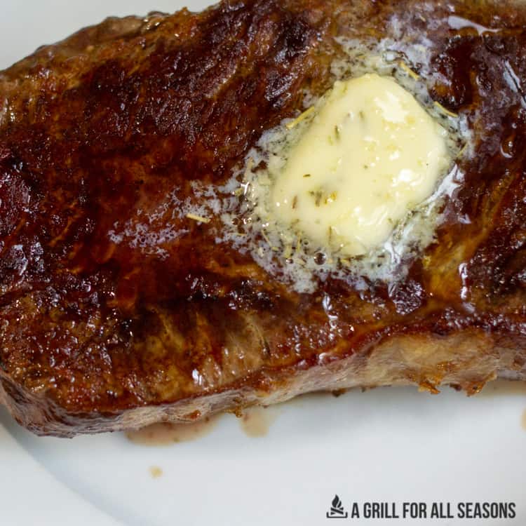 pat of butter melting on a steak