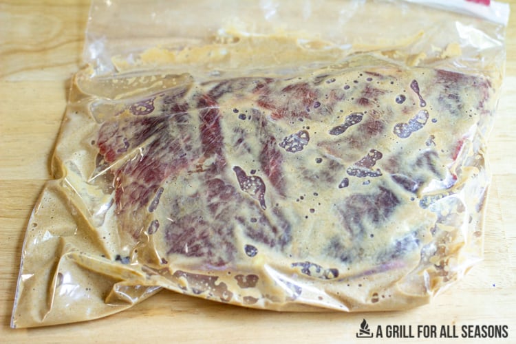steak in plastic sealed bag with marinade