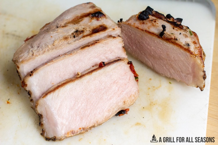 sliced pork on cutting board