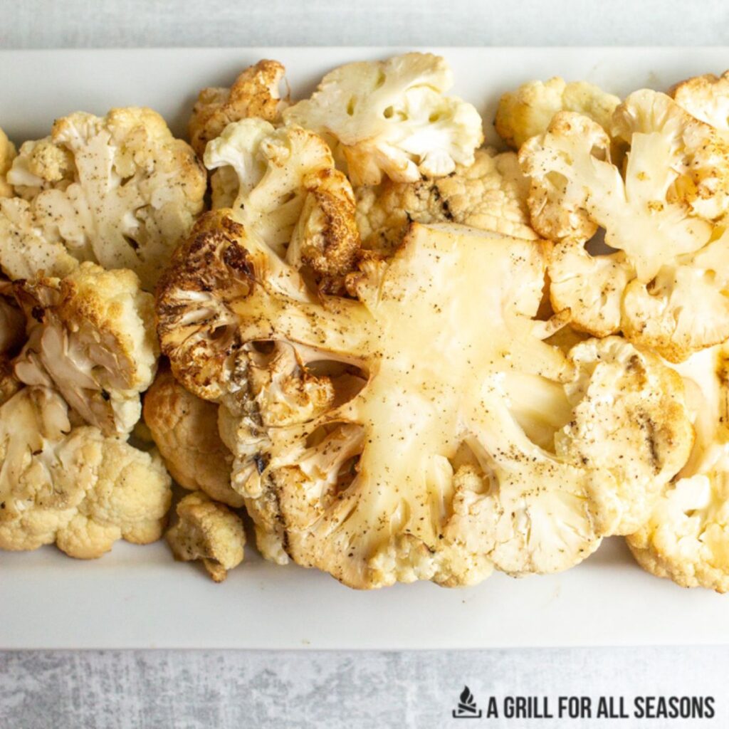 smoked cauliflower on white plate