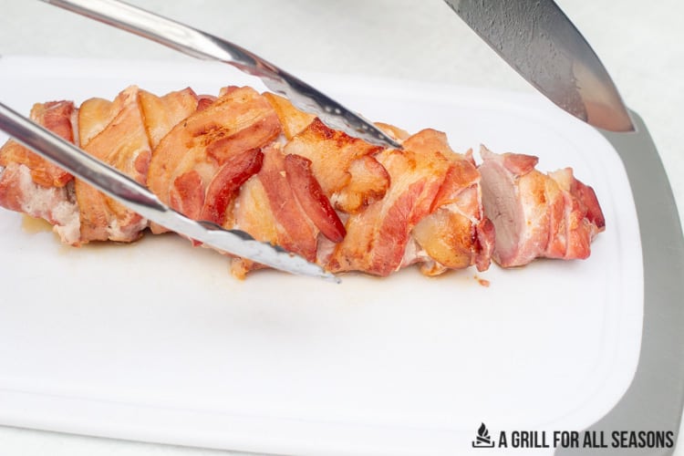 slicing pork on cutting board