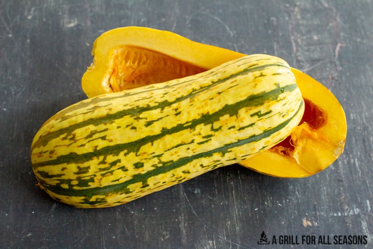 delicata squash cut in half with seeds removed
