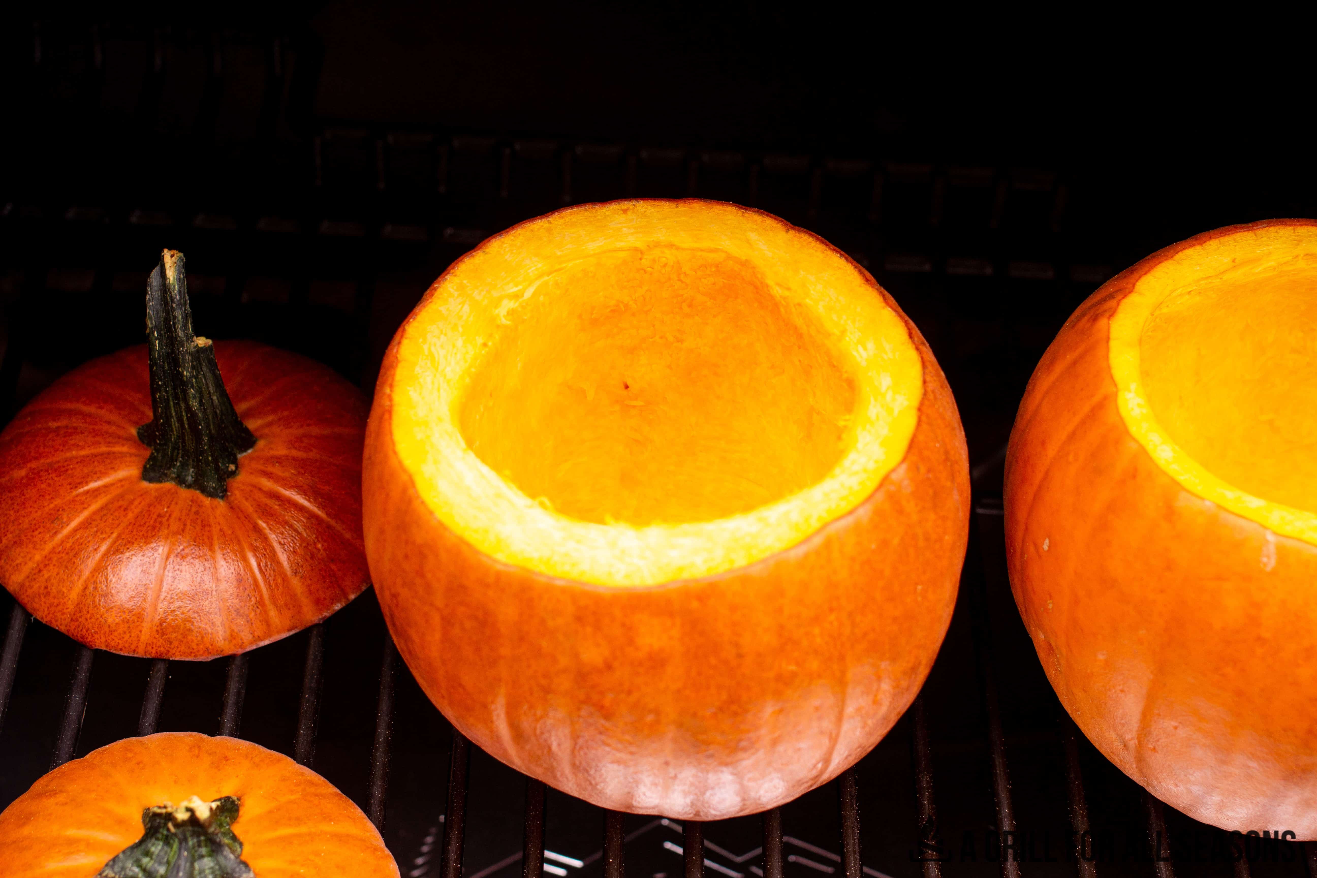 Pumpkins smoking on the Traeger grill.