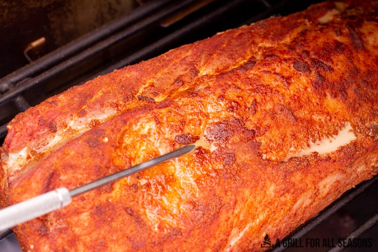 pork loin on the smoker with a temperature probe in it