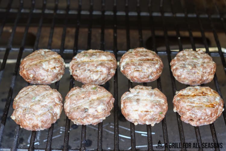 burgers cooking on pellet grill.