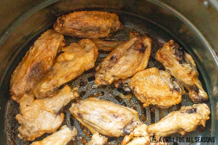 cooked wings in air fryer basket