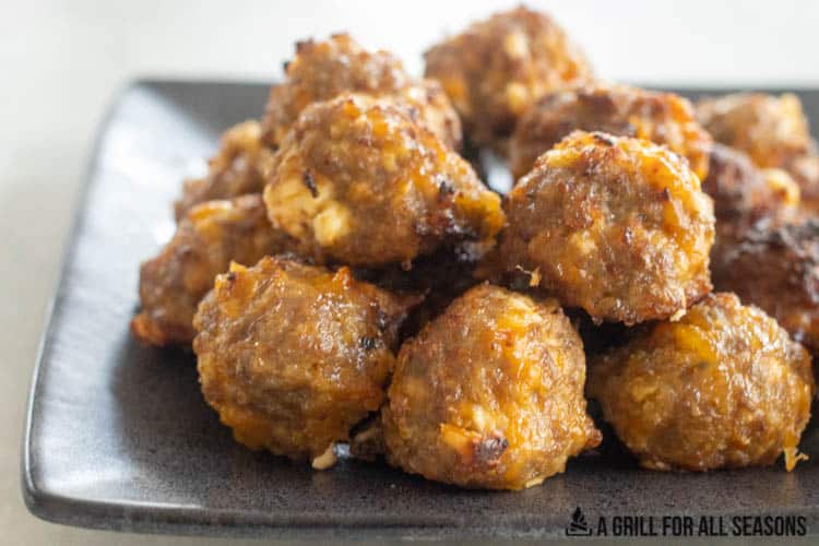 side view of air fried sausage balls on plate