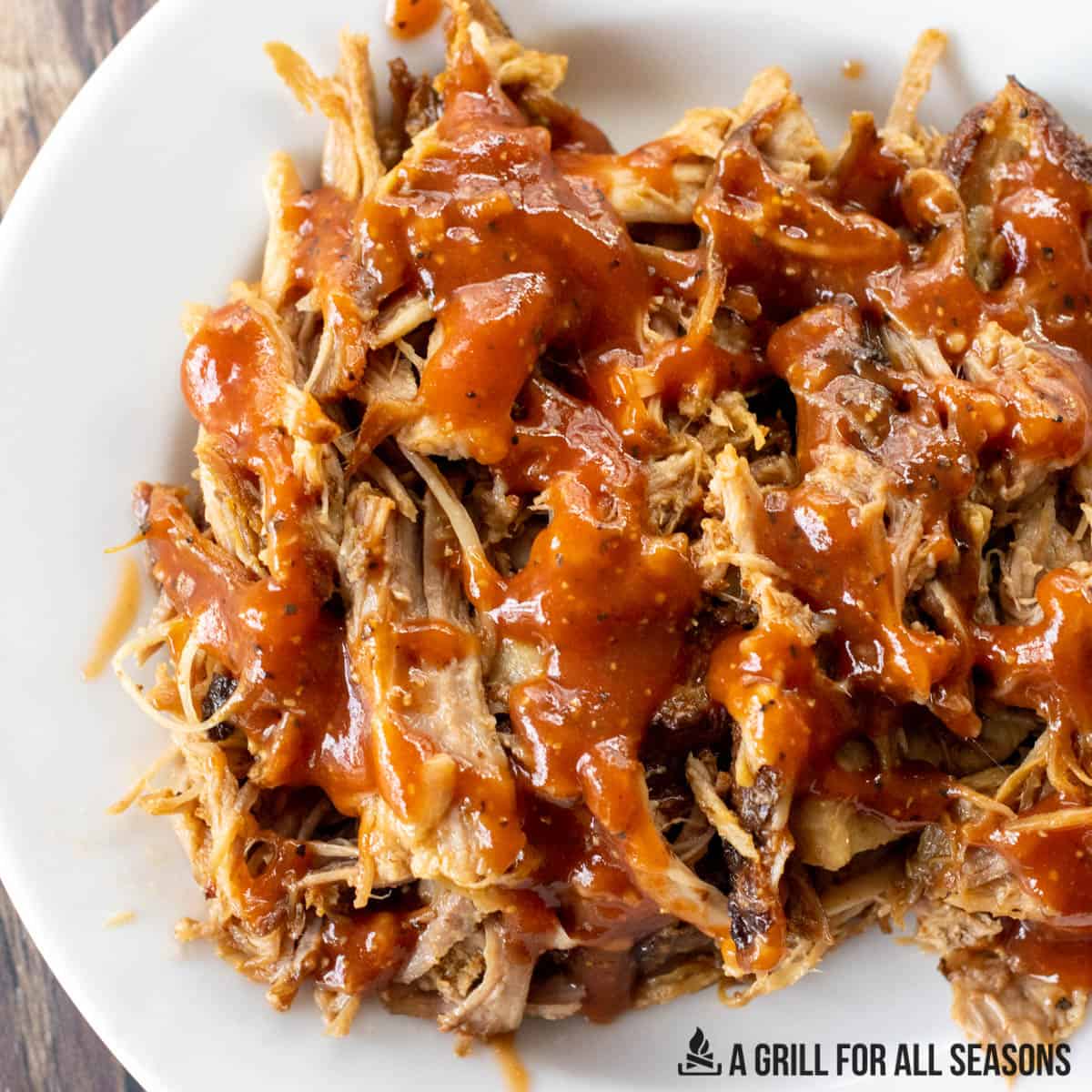 close up of hot honey barbecue sauce on shredded pork