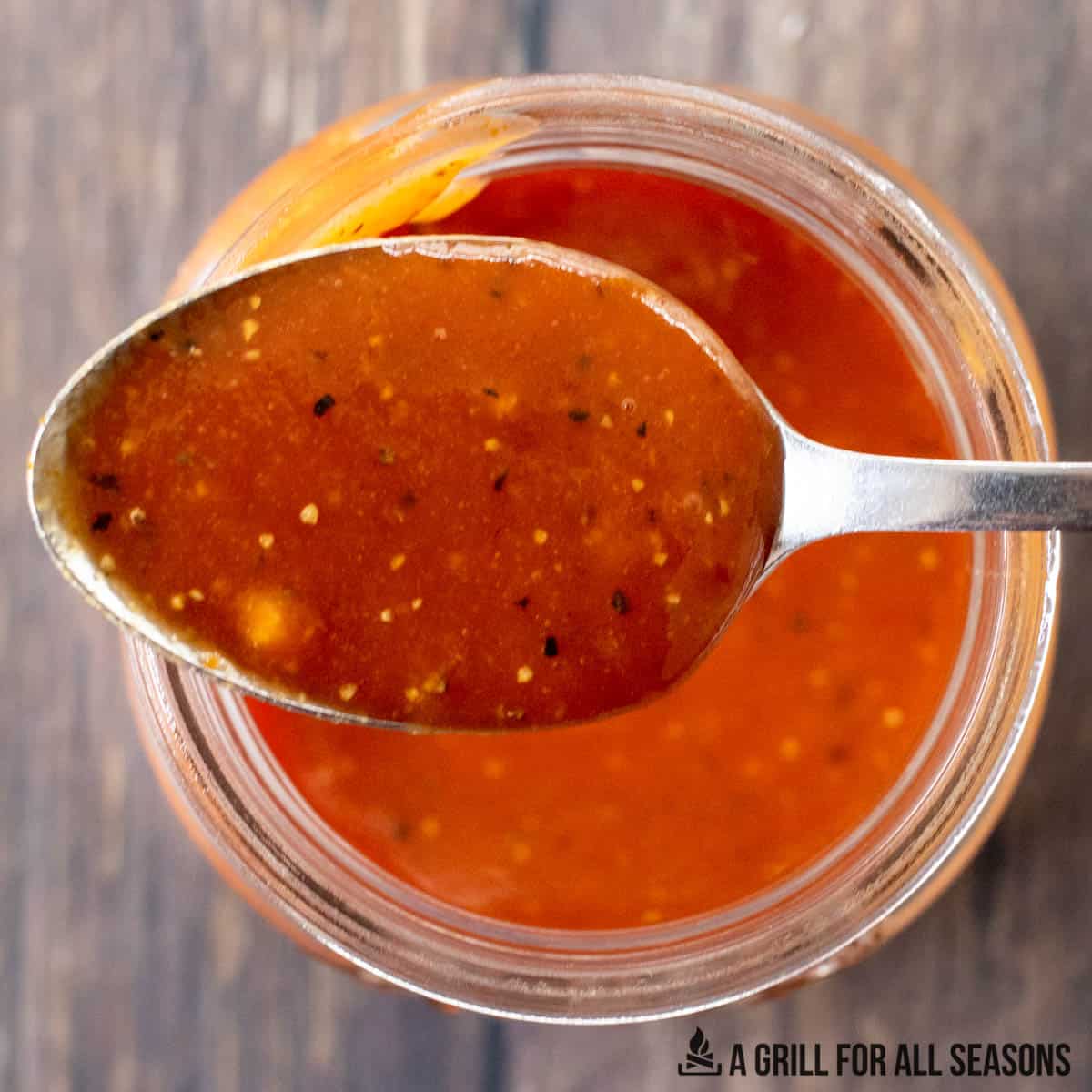 close up of spoon with hot honey bbq sauce
