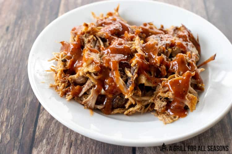 hot honey barbecue sauce on pulled pork on plate