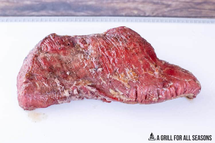 smoked tri tip beef on cutting board