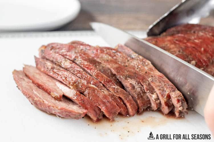 slicing the traeger tri tip steak