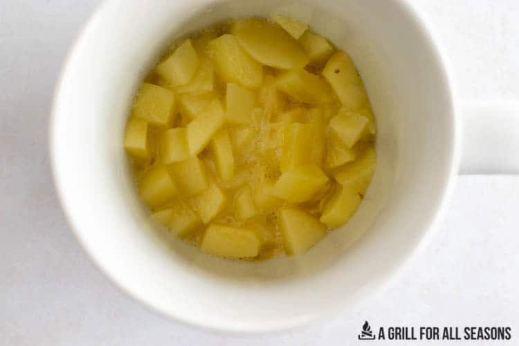 diced apples in coffee cup