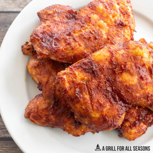smoked boneless skinless chicken thighs on a plate close up