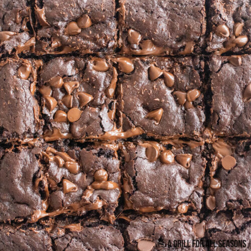 smoked brownies recipe topped with chocolate chips and cut into squares
