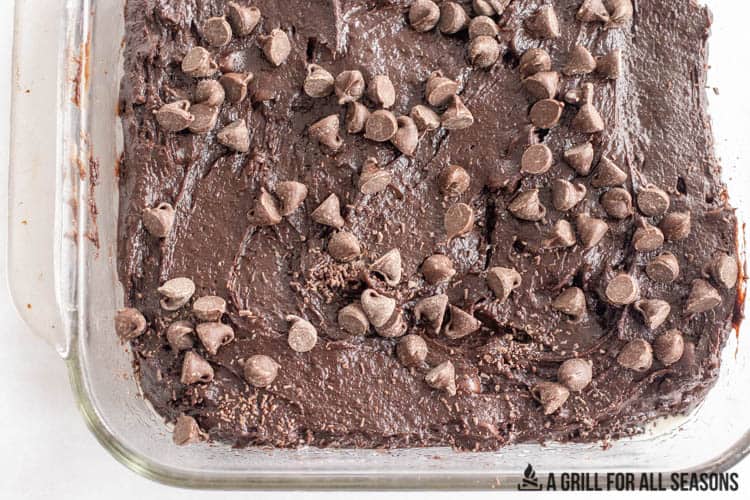 batter with chocolate chips in glass baking dish