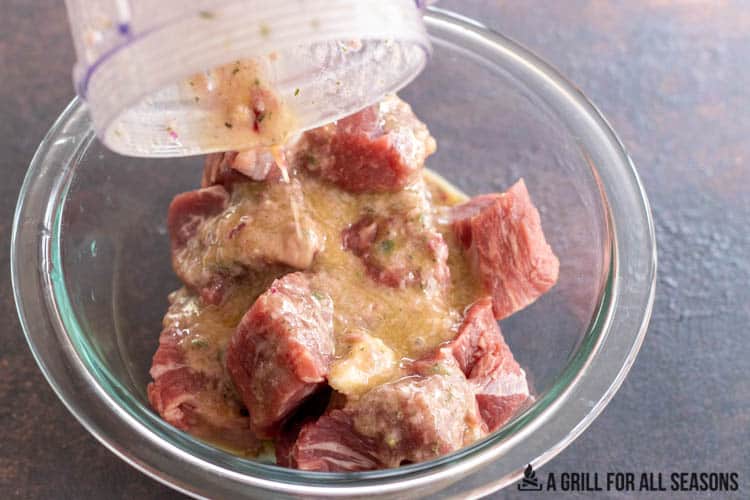 marinade on beef in a bowl