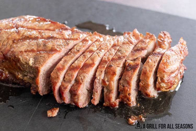sliced traeger steak on cutting board