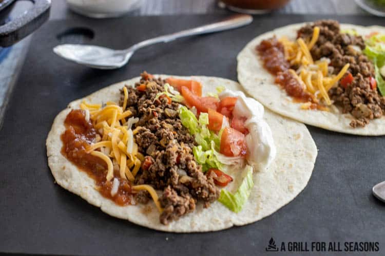tortilla with ground venison taco meat and fixings