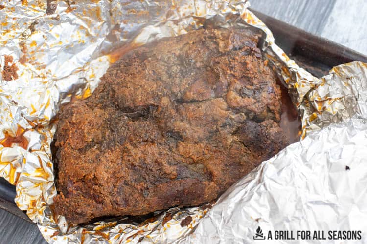 Smoked Chuck Roast resting on foil after being smoked