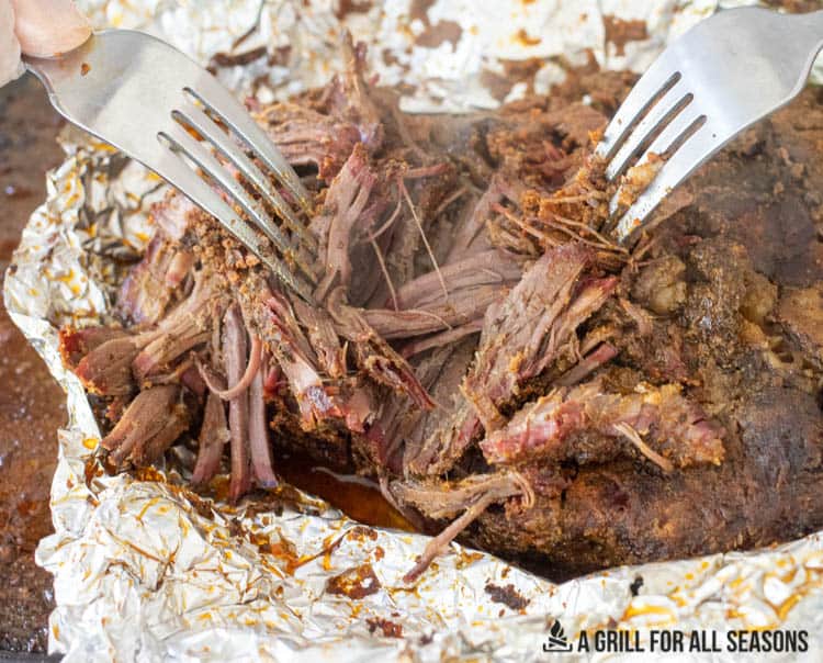 two forks shredded the Smoked Pulled Beef
