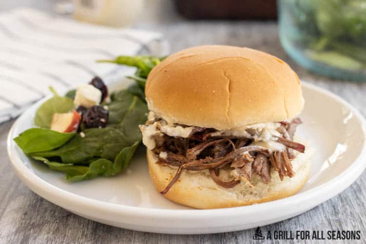 Smoked Pulled Beef on a bun with horseradish sauce