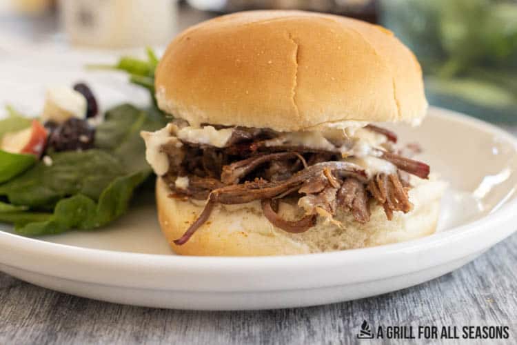 Smoked Pulled Beef on a bun with horseradish sauce