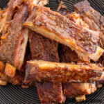 close up of traeger ribs on black plate