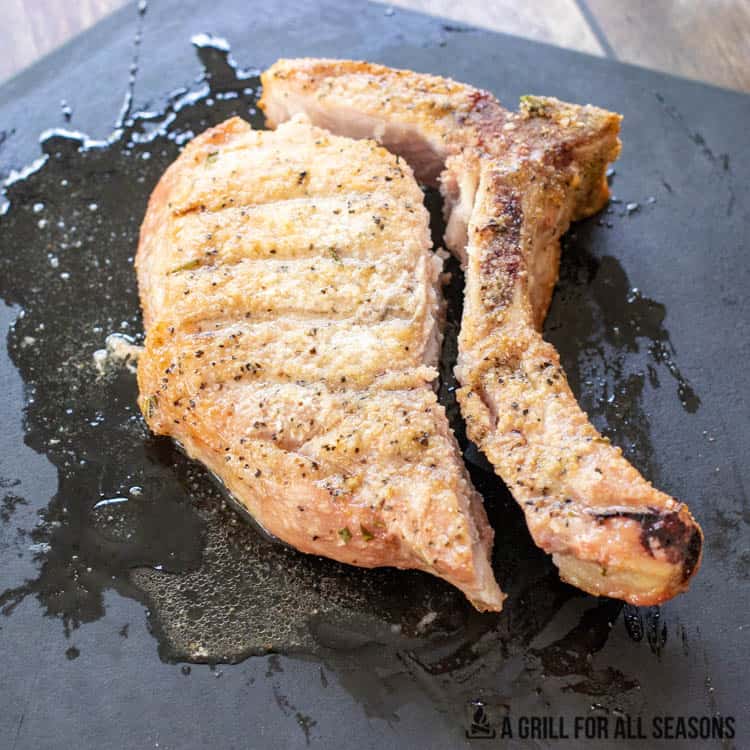 smoked pork chop with bone cut off on cutting board