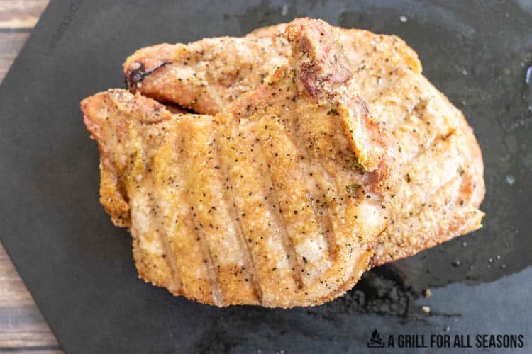 traeger smoked pork chops on cutting board