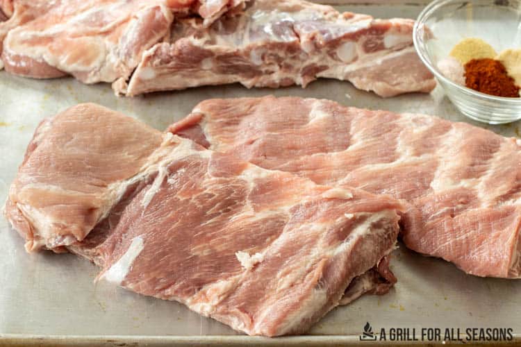 racks of pork ribs on baking sheet