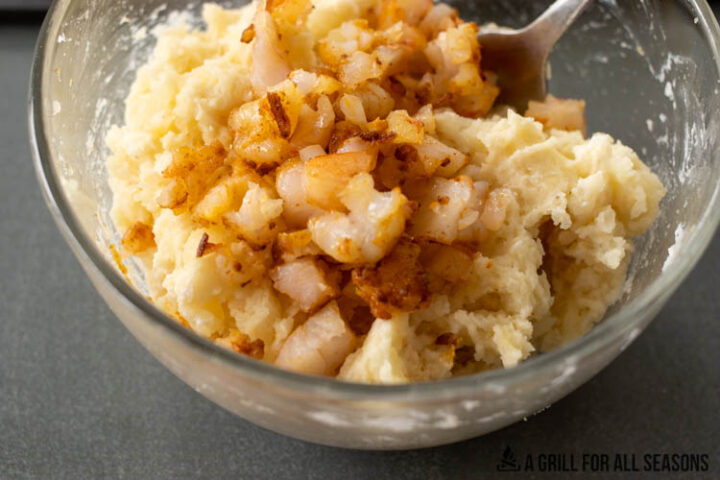 bowl of mashed potatoes with chopped shrimp