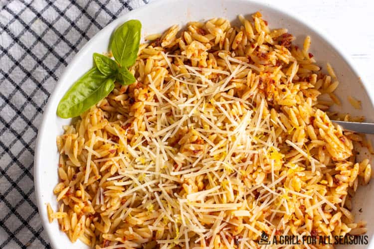 close up of red pesto pasta in bowl