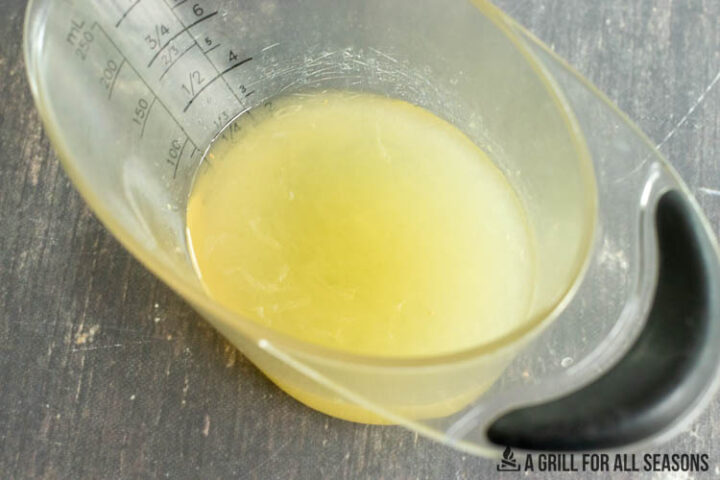 measuring cup with homemade sour mix