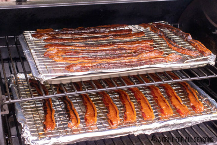 bacon jerky on wire racks on traeger pellet grill