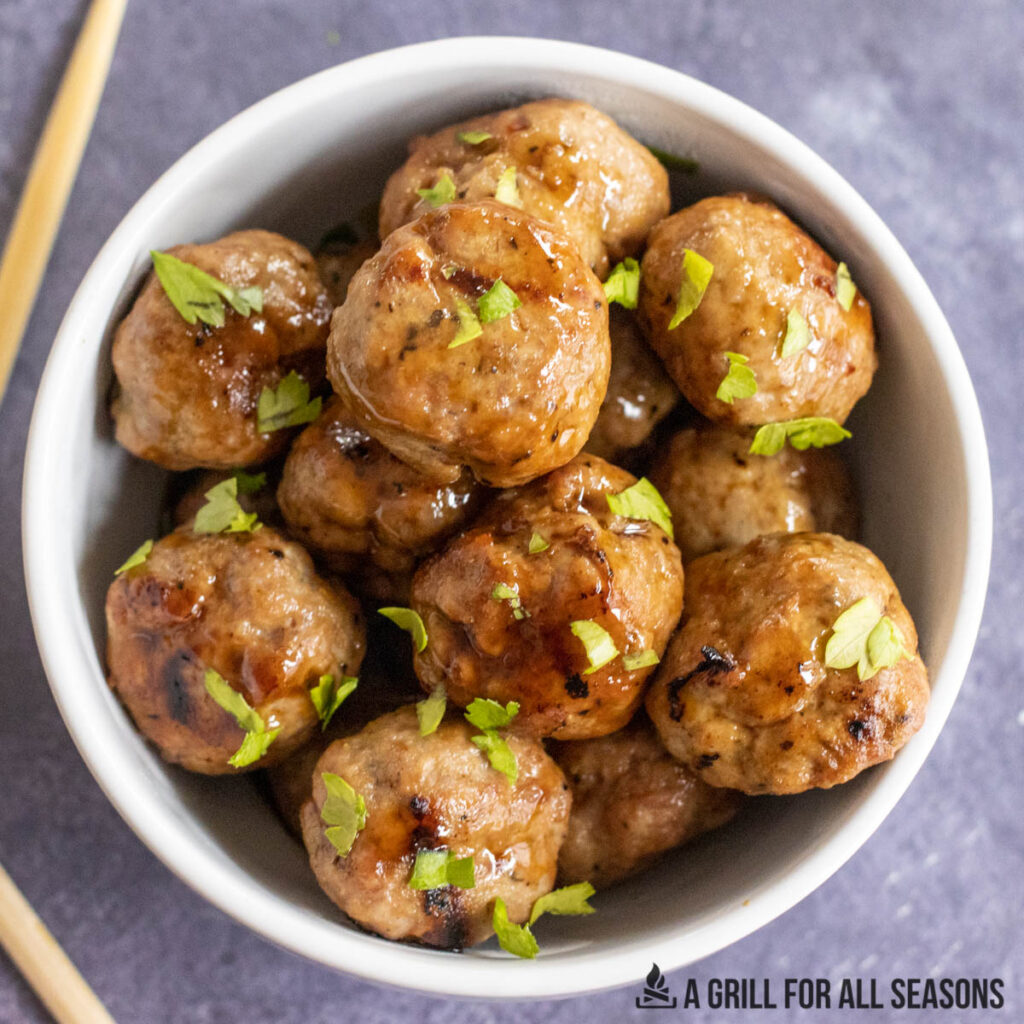 bowl of asian pork meatballs close up