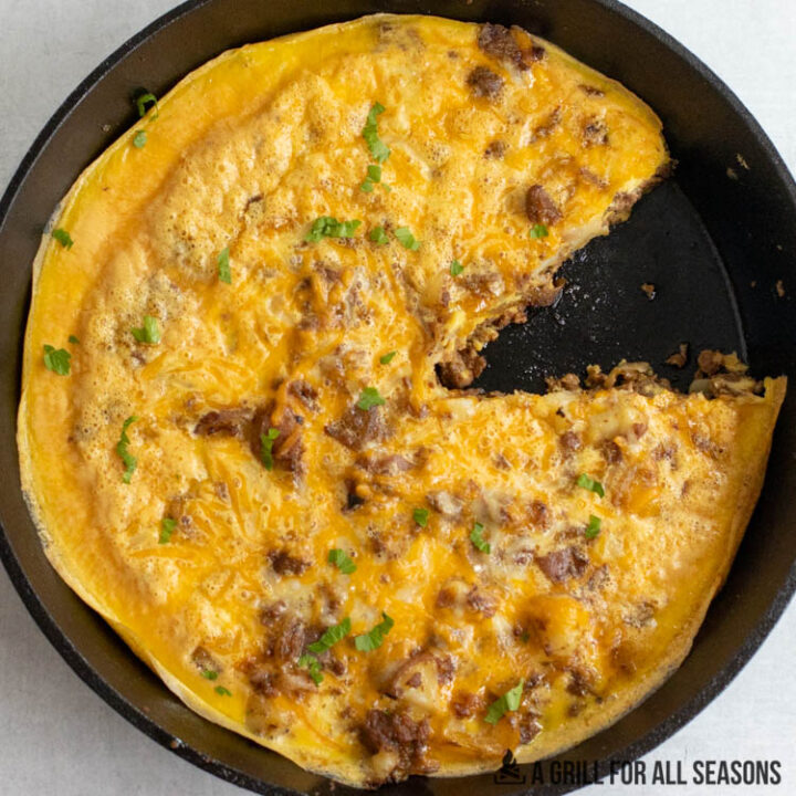 smoked breakfast casserole in cast iron pan missing a piece