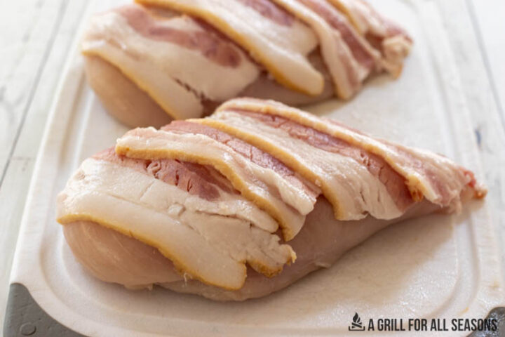 chicken breasts topped with strips of bacon