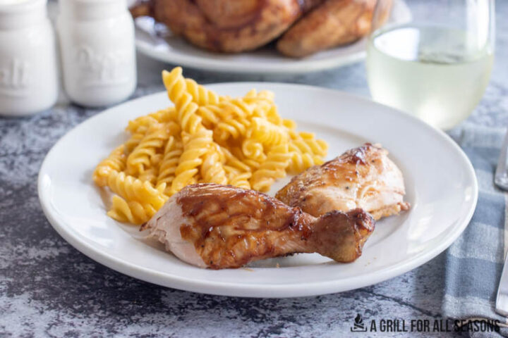 drumstick on plate with mac and cheese