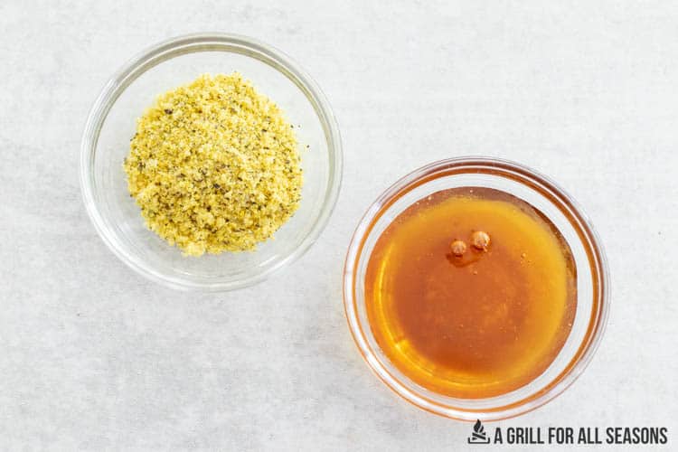 hot honey and lemon pepper seasonings in two small bowls