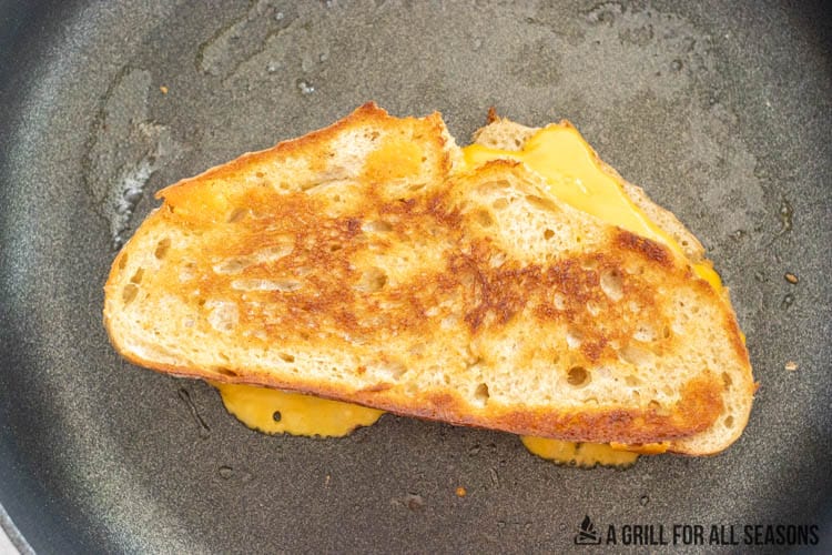 sourdough grilled cheese sandwich in a skillet