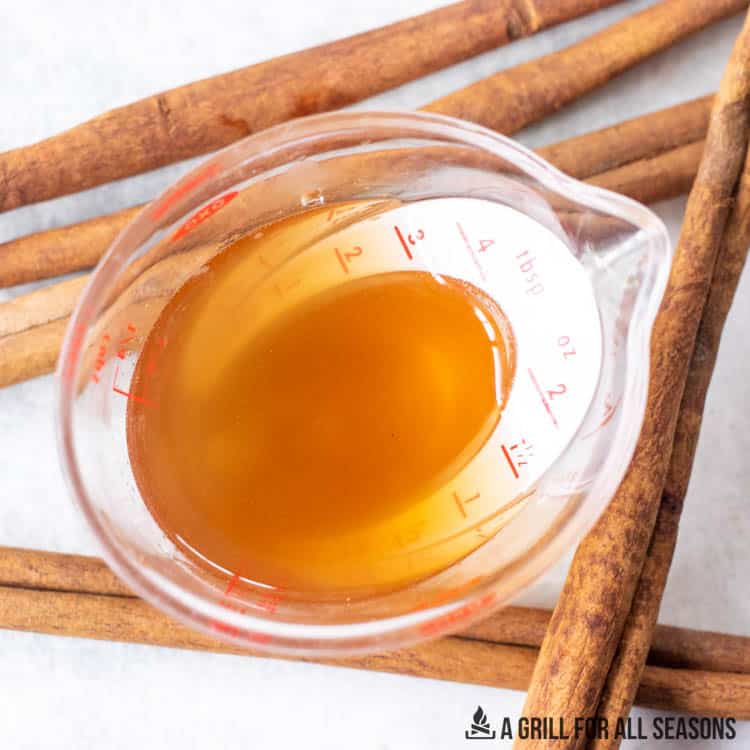 cinnamon simply syrup in small measuring cup