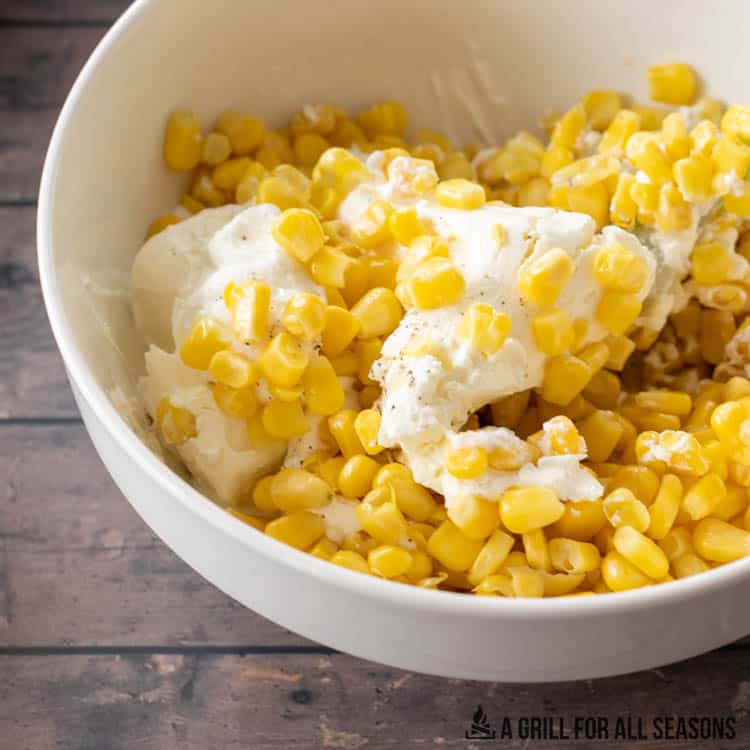 mixing bowl with cream cheese and corn