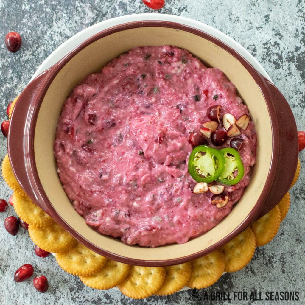 overhead shot of cranberry jalapeno dip with crackers