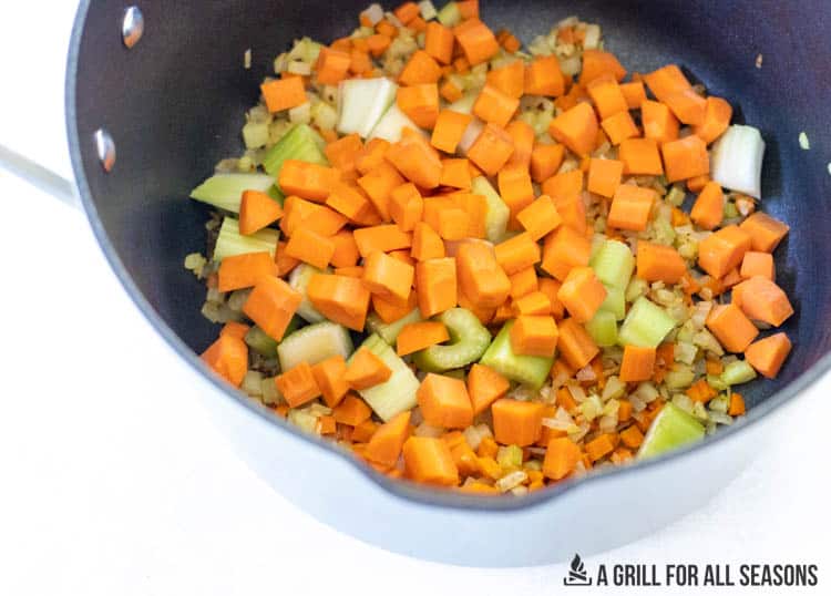 chunks of carrots and celery in pot
