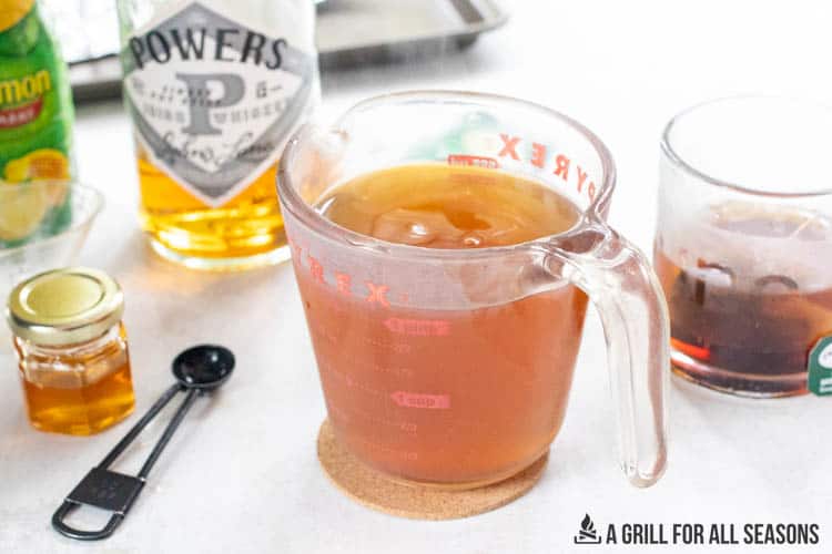 measuring cup with hot toddy mixture