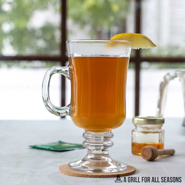 smoked hot toddy in a tall hot glass cup