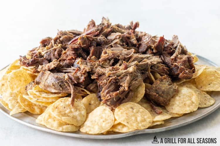 platter with tortilla chips and shredded beef