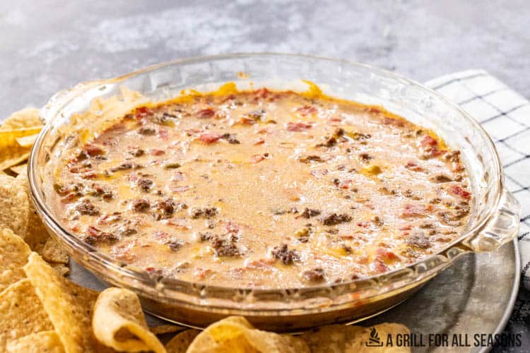 finished smoked queso recipe with tortilla chips