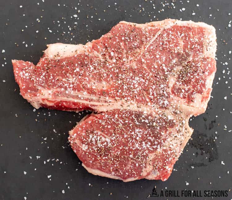 seasoned steak on cutting board